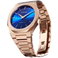 Montre D1 Milano Petite GEO Ultra Thin 34 - Femme Quartz- Cadran Bleu- 34 Mm - Acier Et PVD Rose - UTBL12 -Accessoires De Mode ori montre d1 milano petite geo ultra thin 34 femme quartz cadran bleu 34 mm acier et pvd rose utbl12 41353 59665
